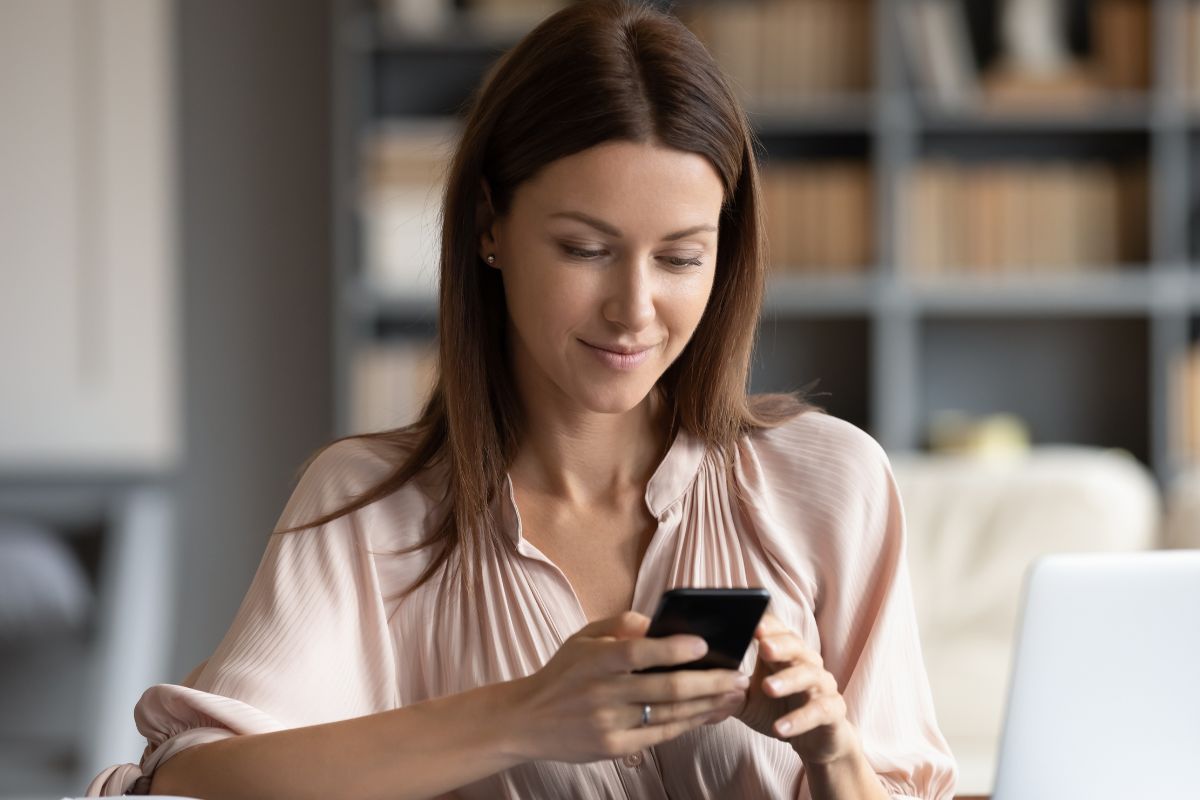 A picture of someone looking at their phone.