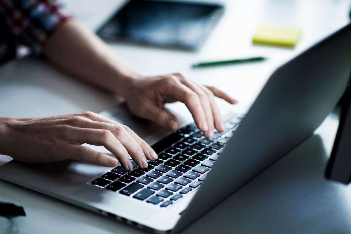 A picture of someone using their laptop.