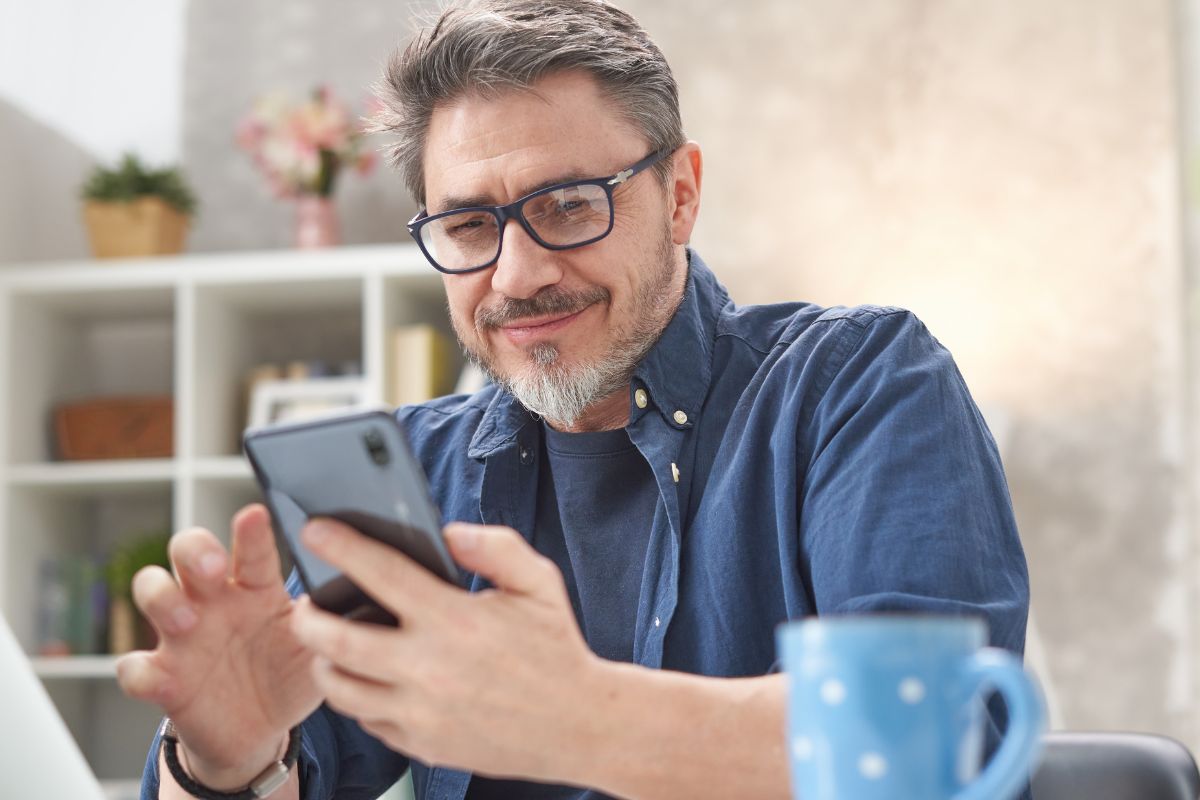 A picture of an old person using a phone.