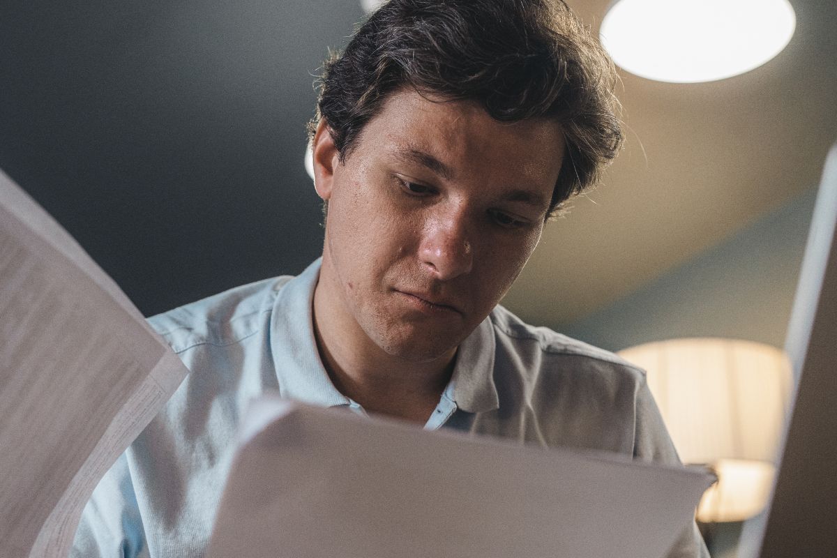 A picture of someone looking at their papers.