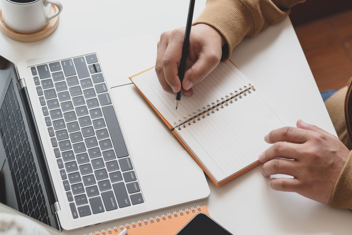 A picture of someone writing something. 