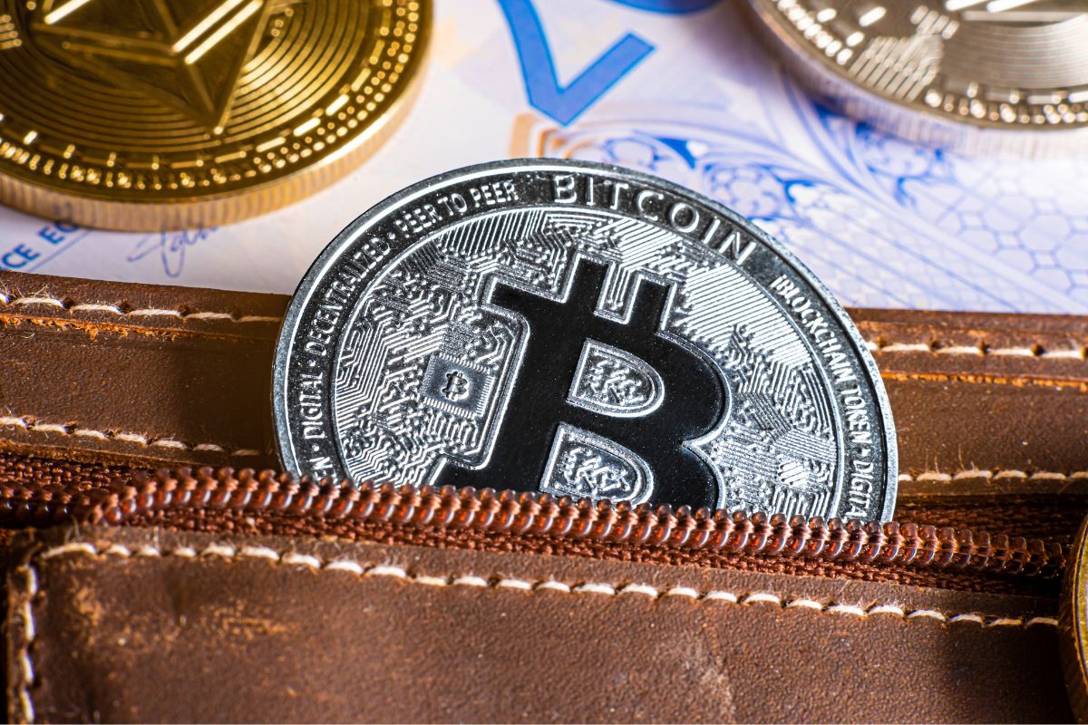 A picture of a Bitcoin coin in a wallet.