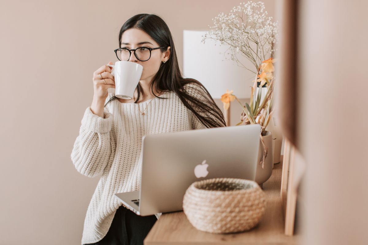 A picture of someone sipping coffee.