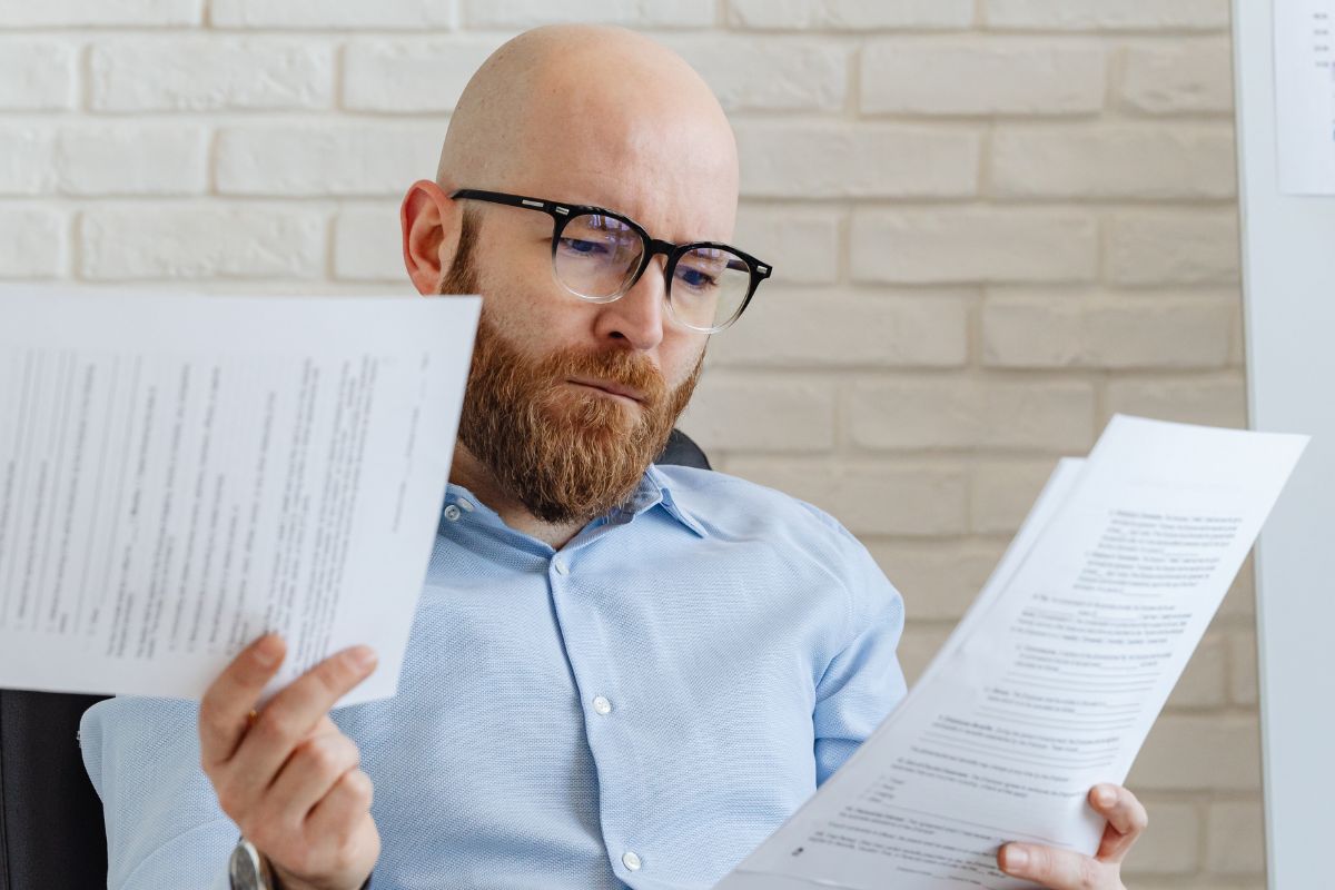 A picture of someone looking at their papers.
