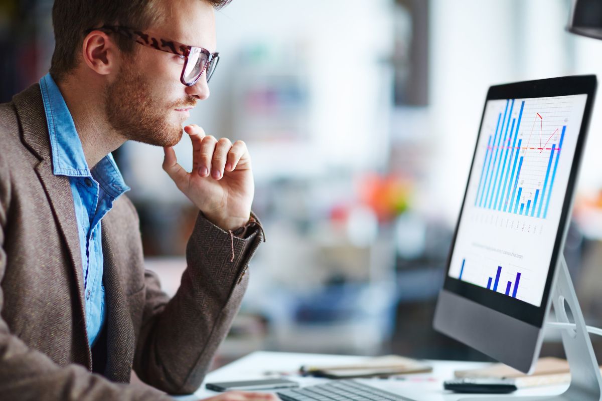 A picture of someone looking at graphs.