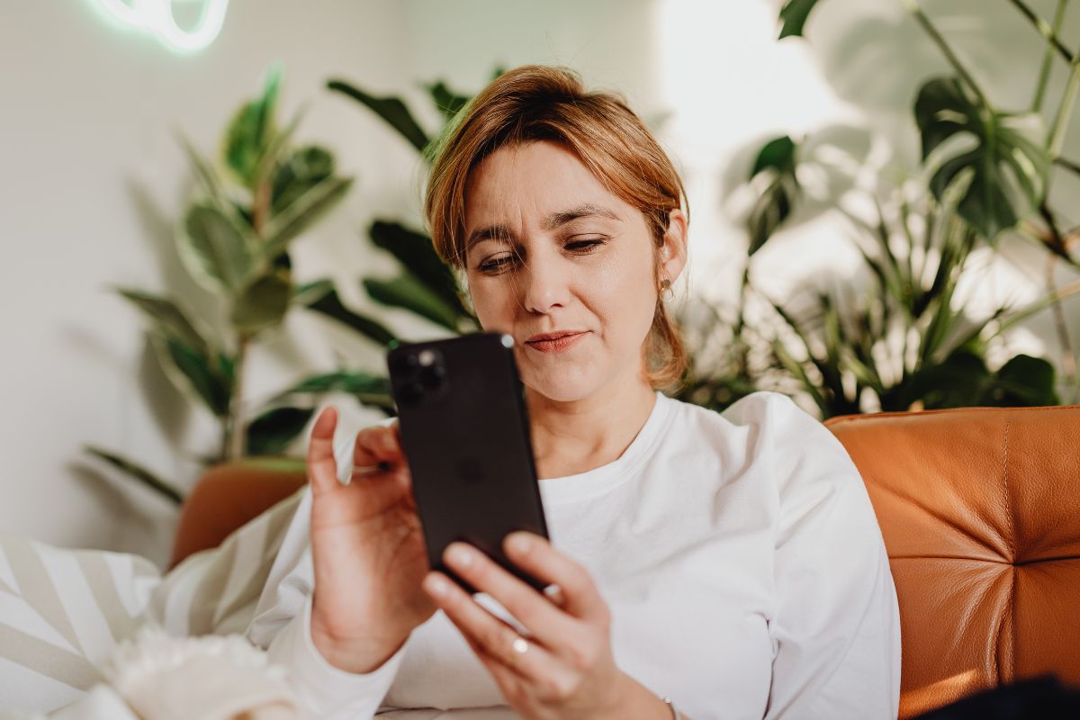 A picture of someone using their phone.