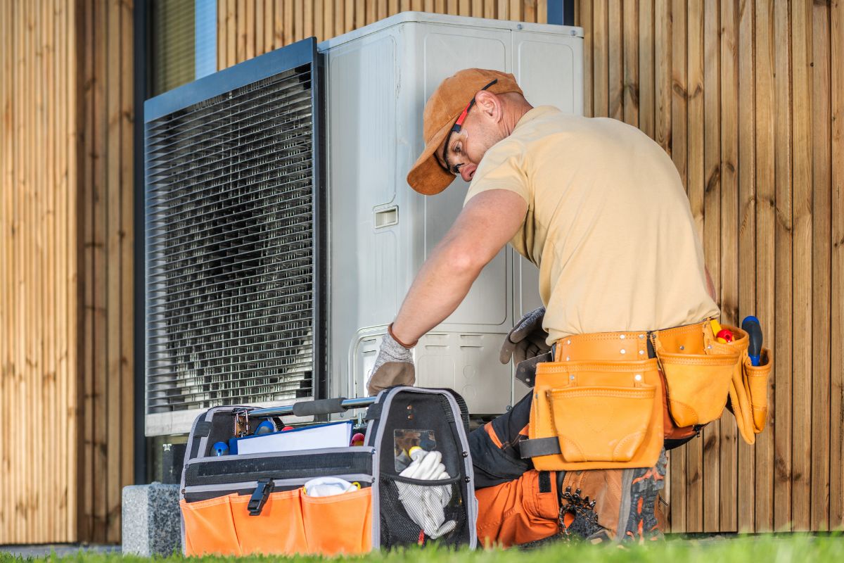 A picture of someone fixing their HVAC.
