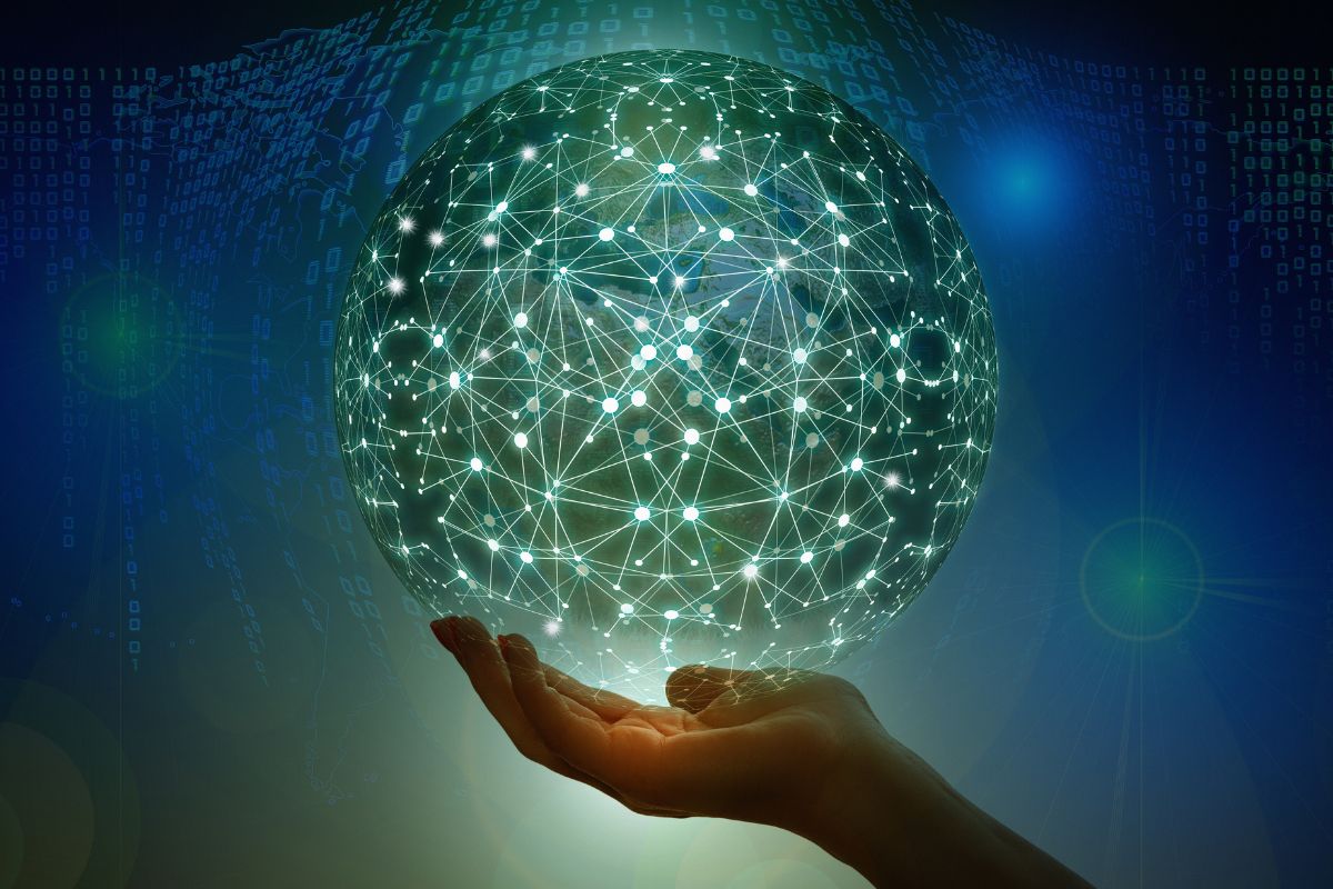 A picture of someone holding a digital globe.