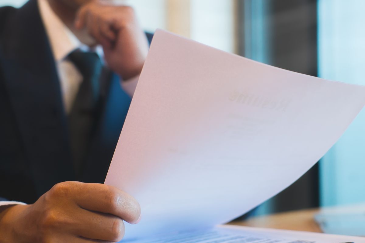 A picture of someone holding a paper.