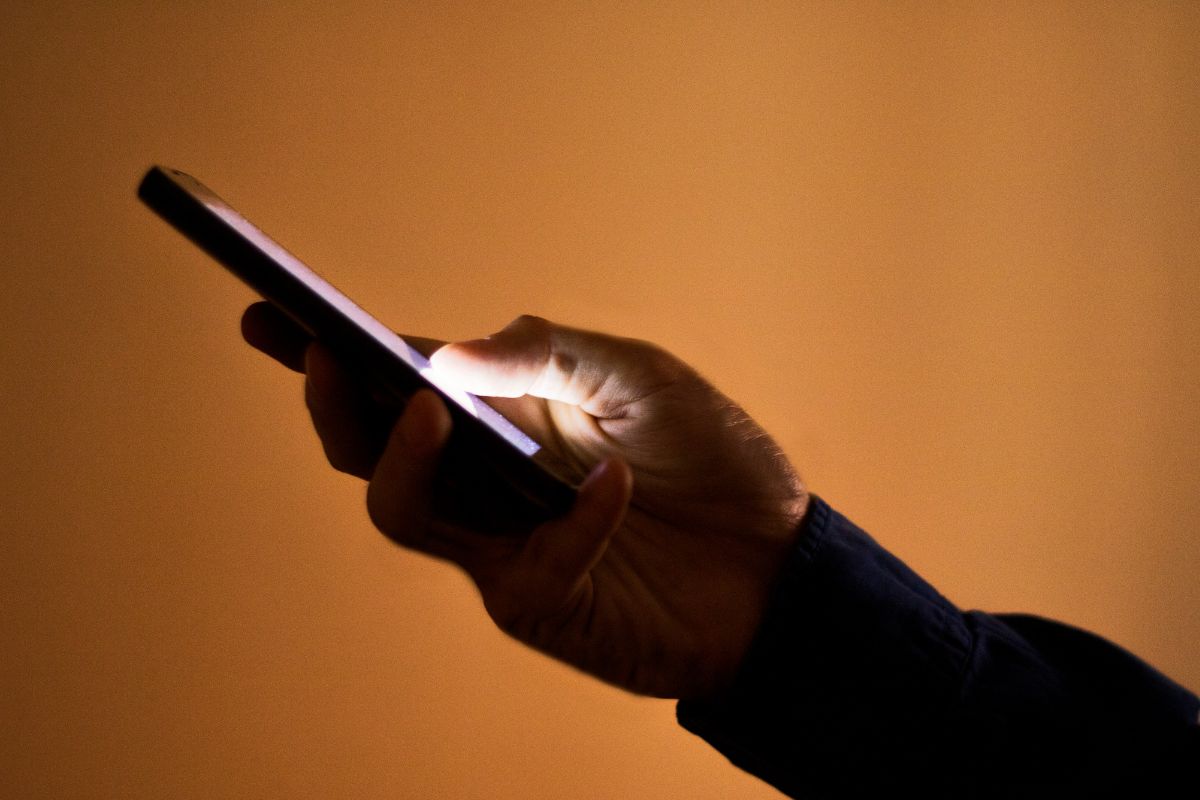 A picture of someone using their phone.