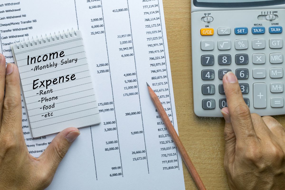 A picture of someone tracking their money.