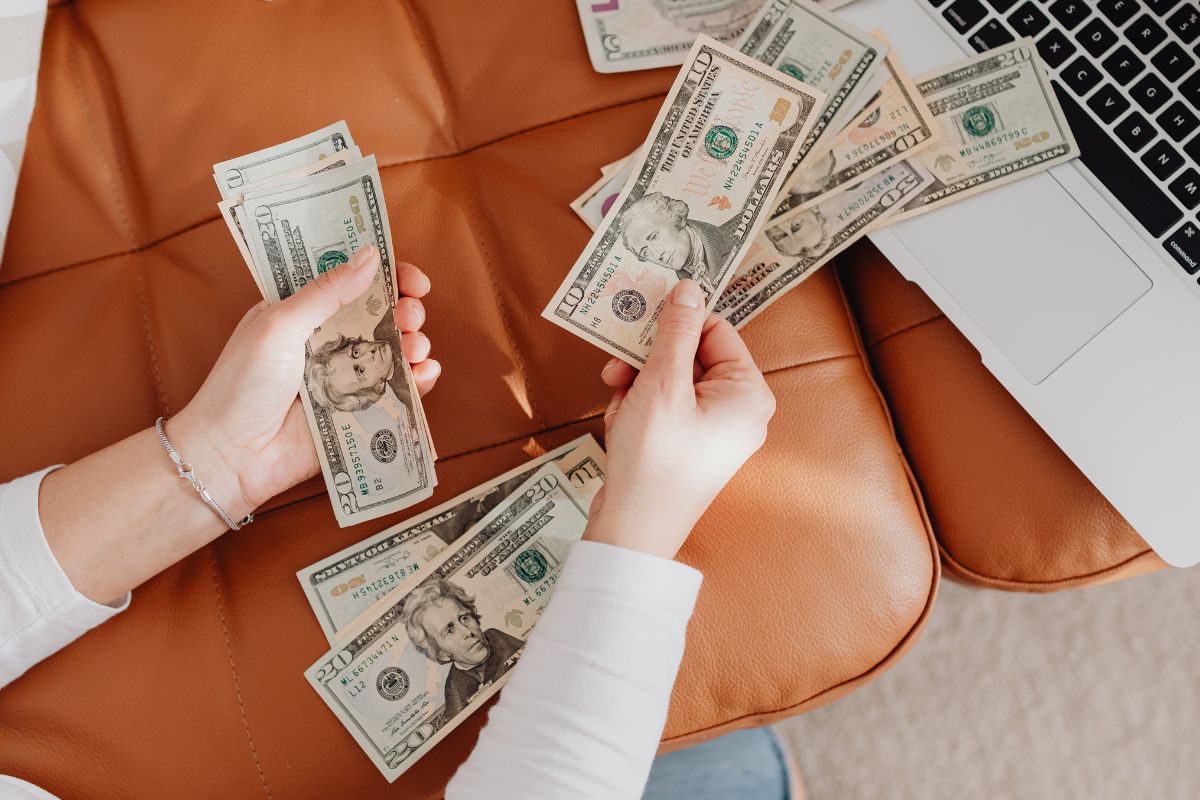 A picture of someone counting their money.