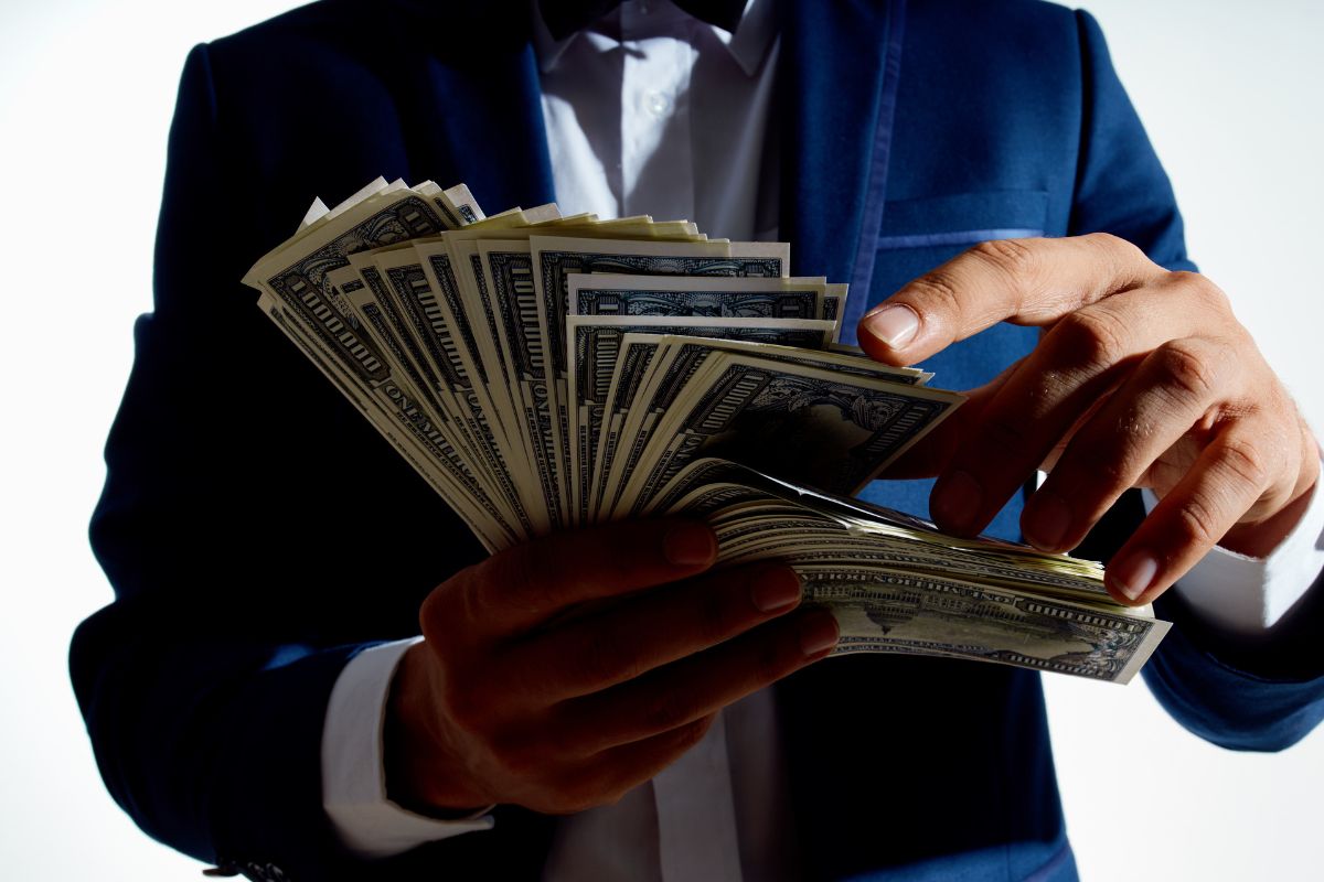 A picture of someone counting money.