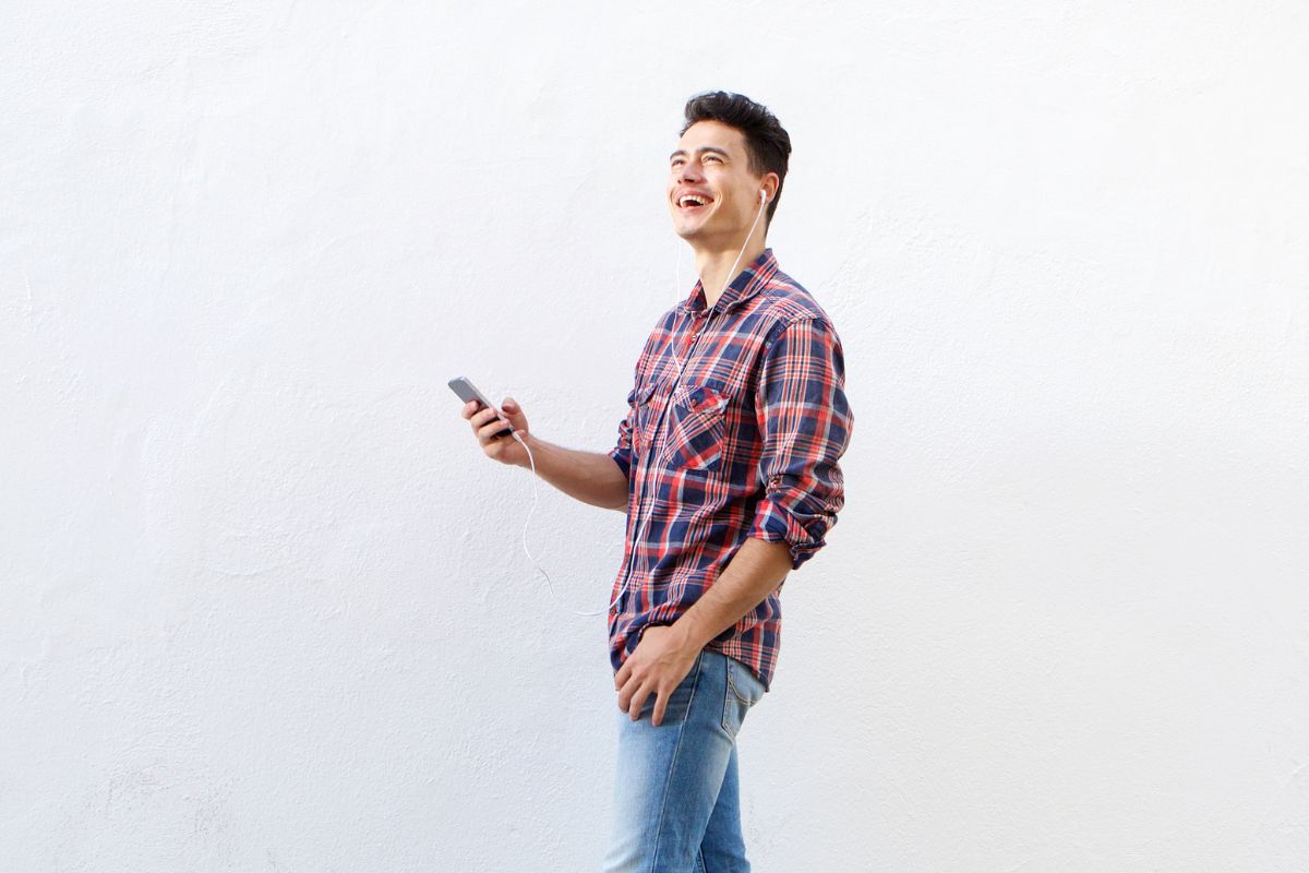 A picture of someone happily walking.