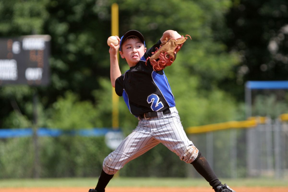 A picture of a kid playing baseball.