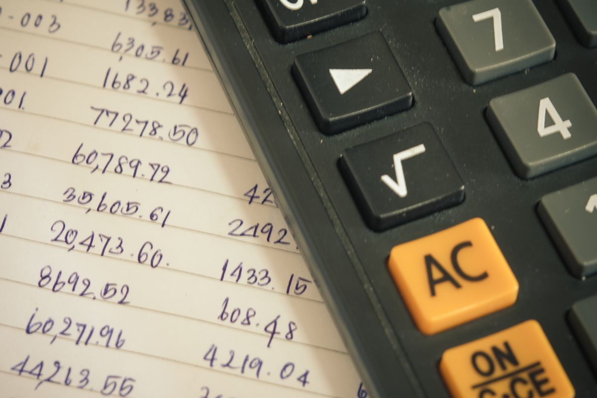 A picture of a list of numbers and a calculator.