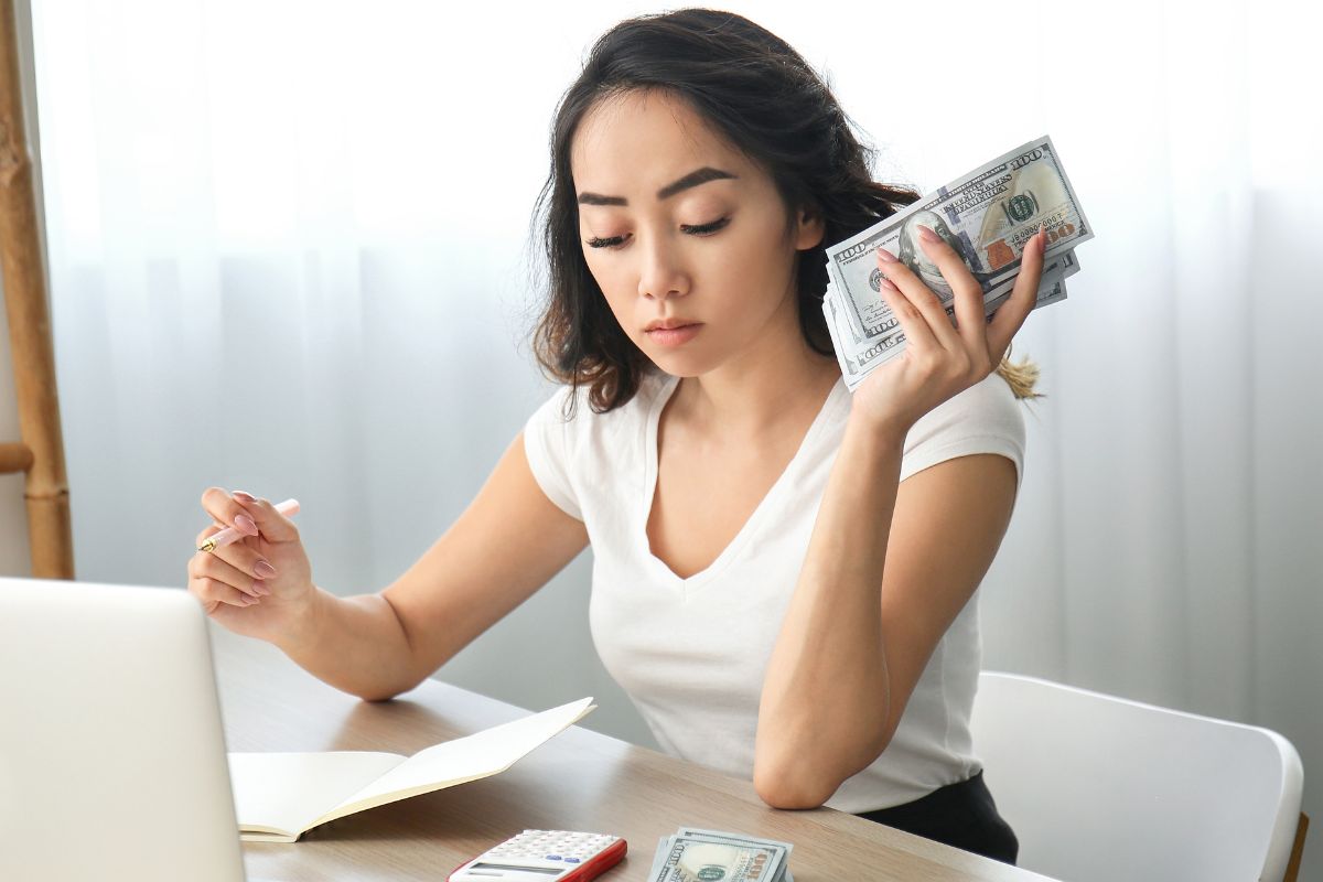 A picture of someone counting money.