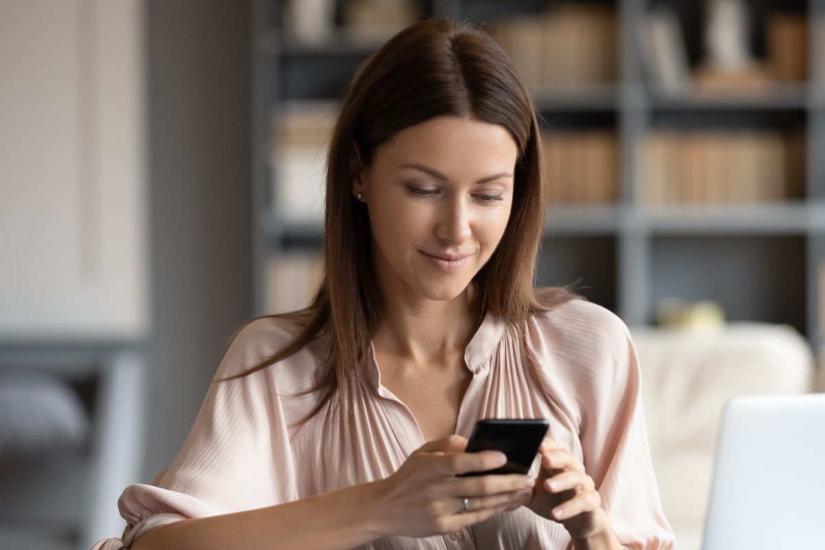 A picture of someone looking at their phone.