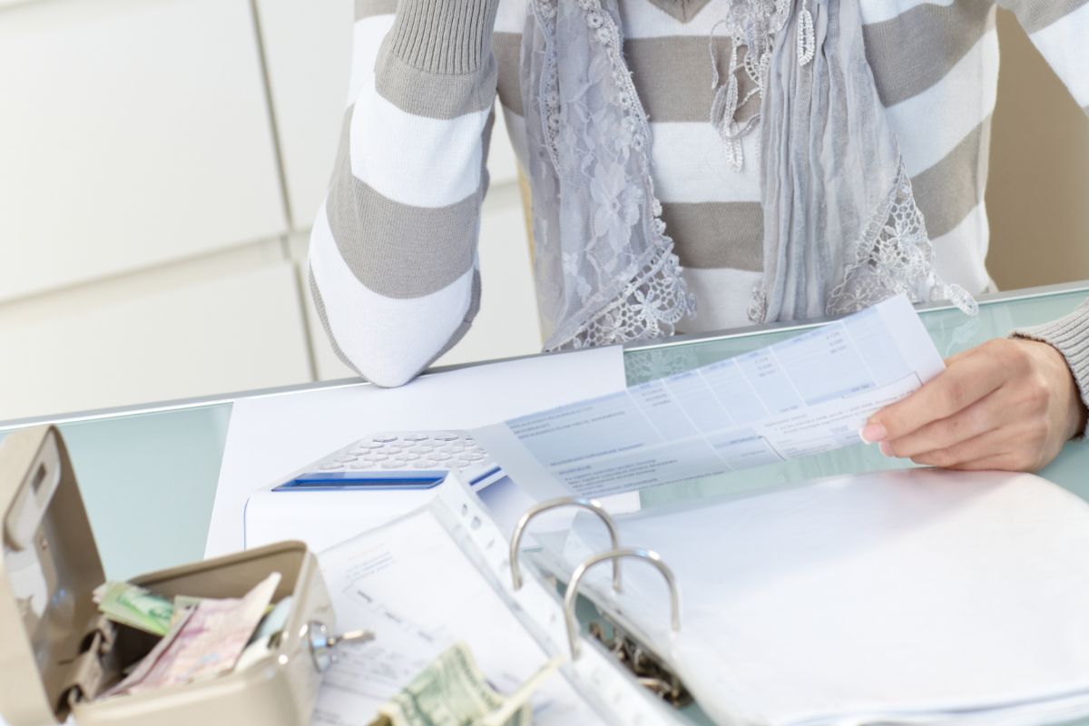 Picture of a woman tracking her expenses.