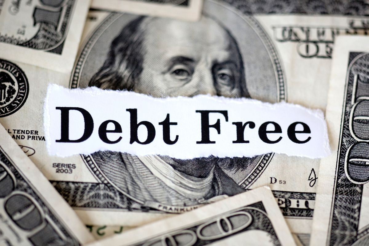 Picture of money and debt-free wording.