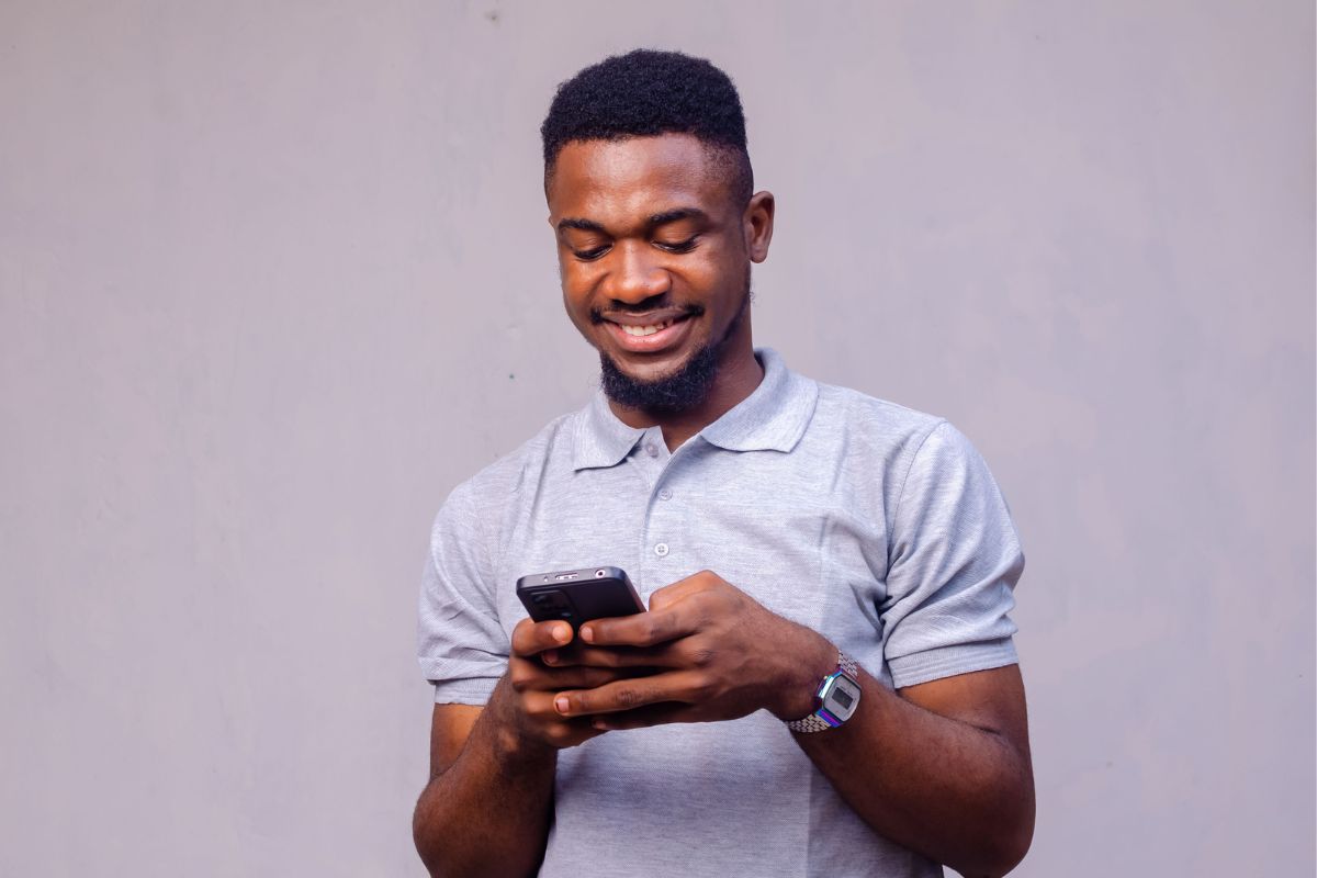 A picture of someone texting.