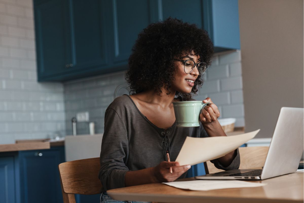 A picture of someone using their laptop while relaxing.