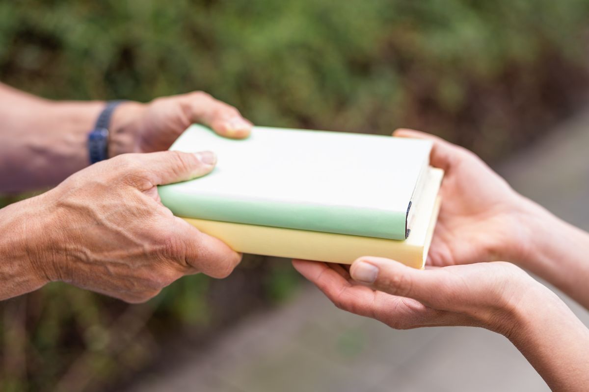 A picture of people trading objects.