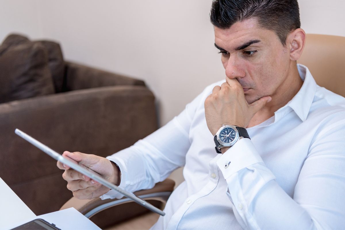 A picture of someone looking at their gadget.