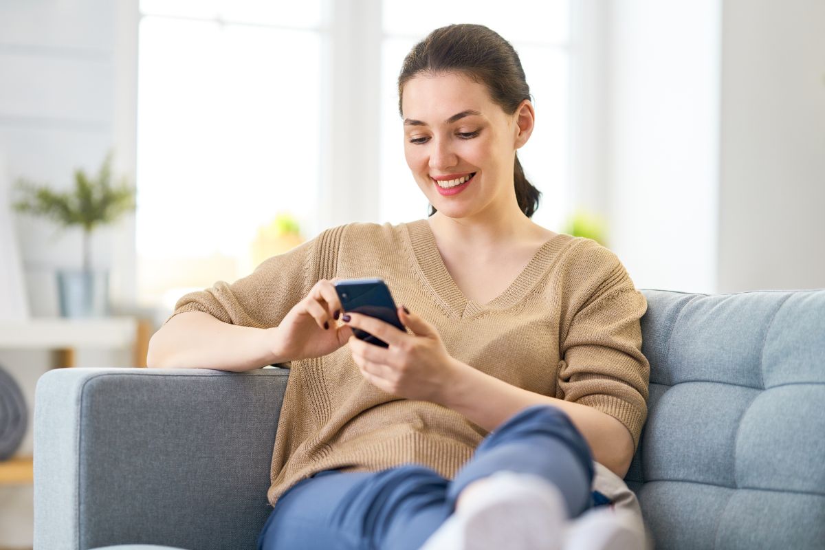 A picture of someone relaxing on a sofa.