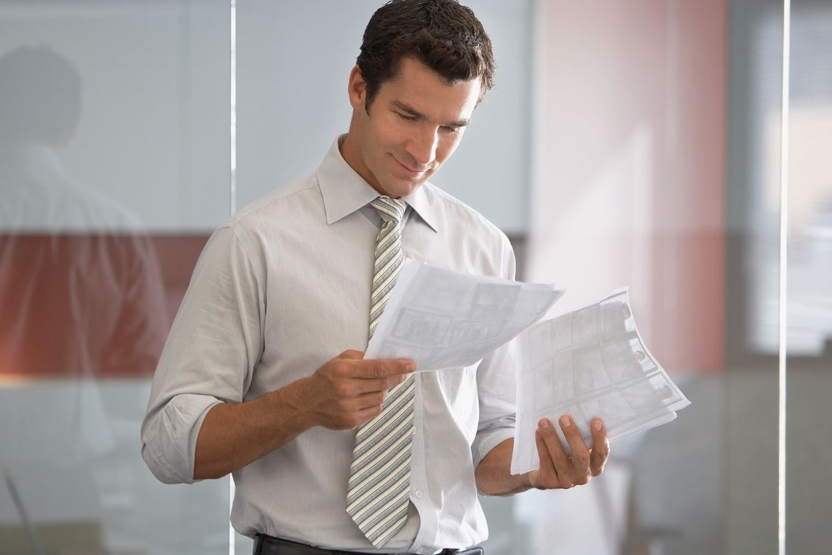 A picture of someone looking at his papers.