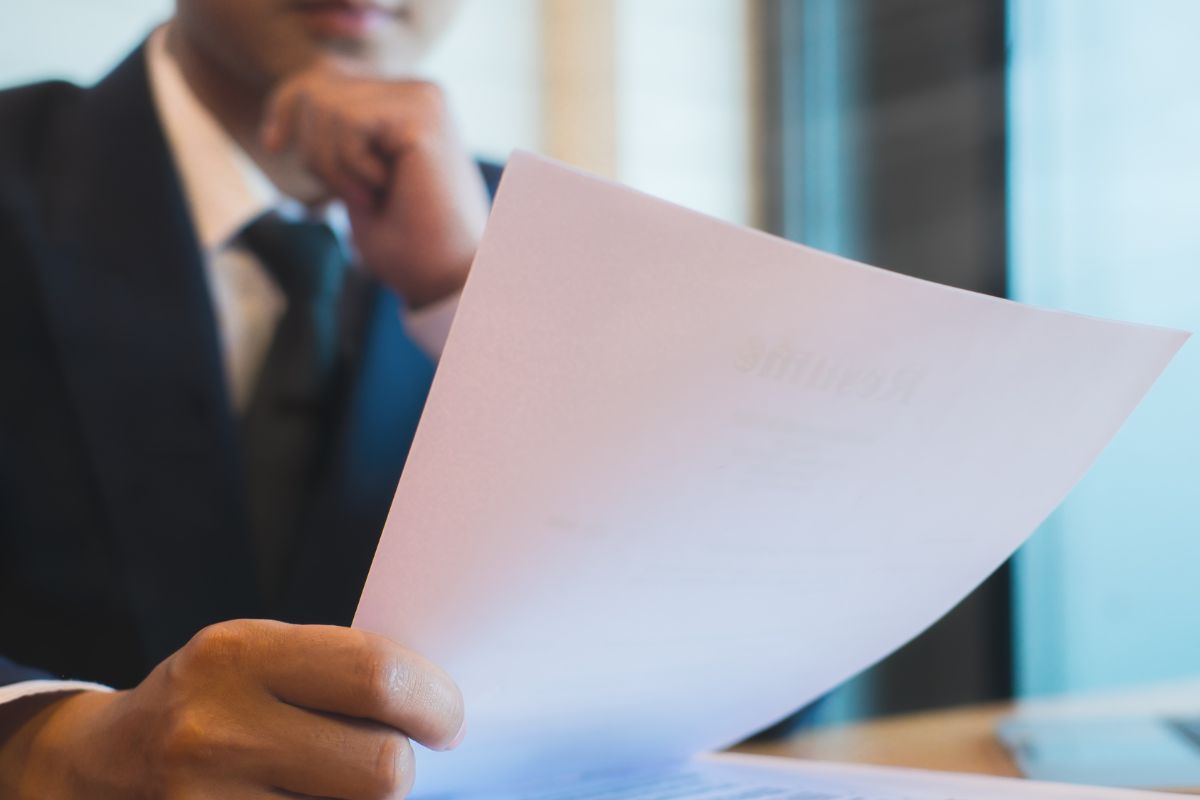 A picture of someone looking at a piece of paper.