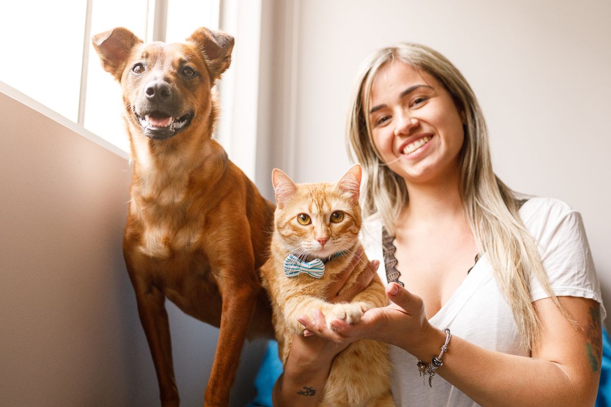 A picture of pets and their petsitter.