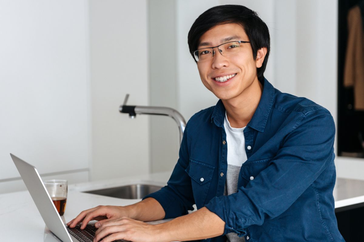 A picture of someone using their laptop.