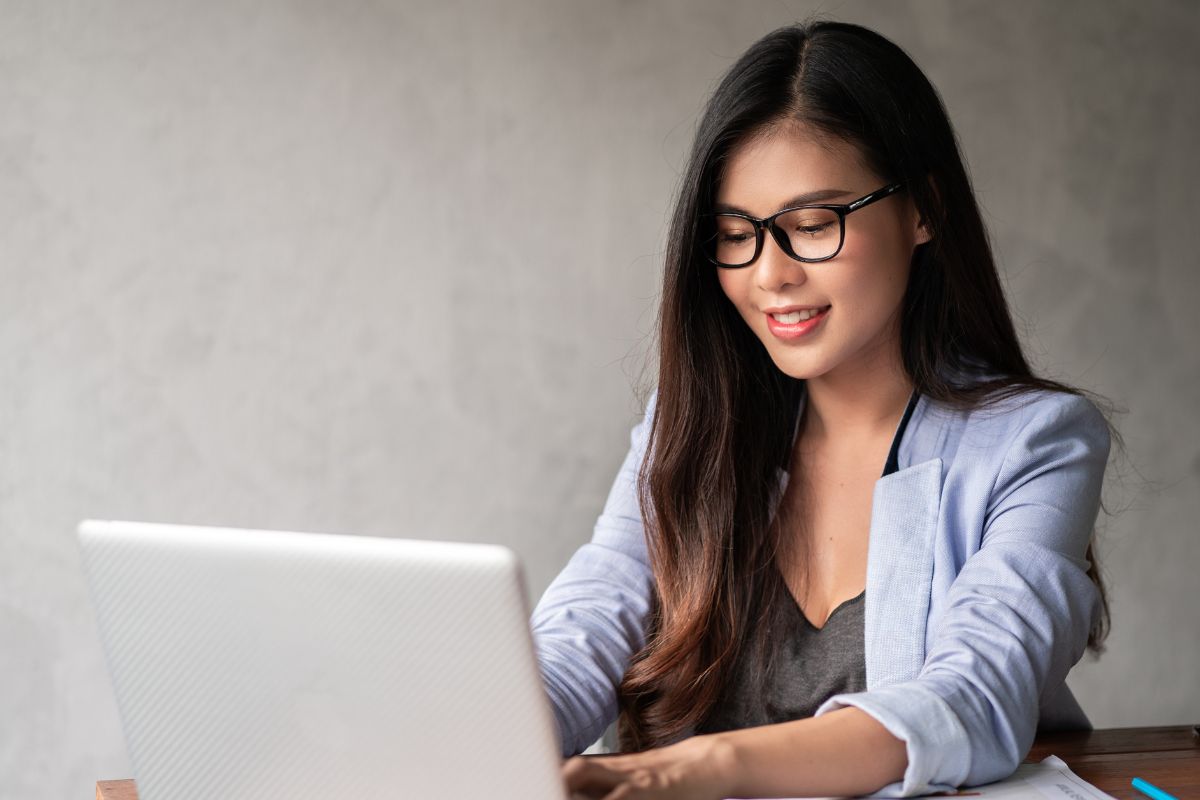 A picture of someone using their laptop.