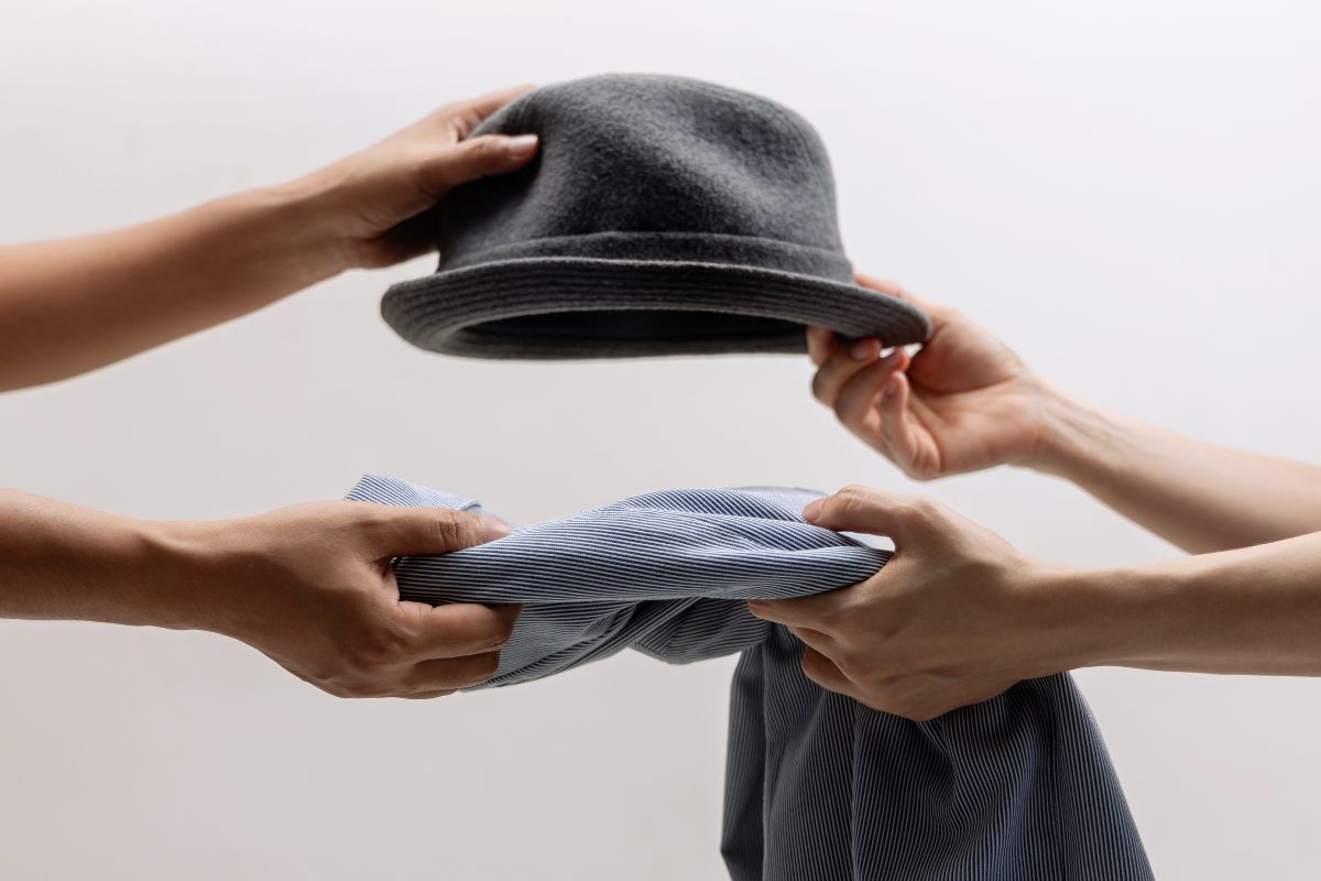 A picture of people swapping clothes.