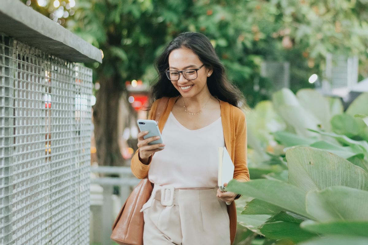 A picture of someone smiling while walking.