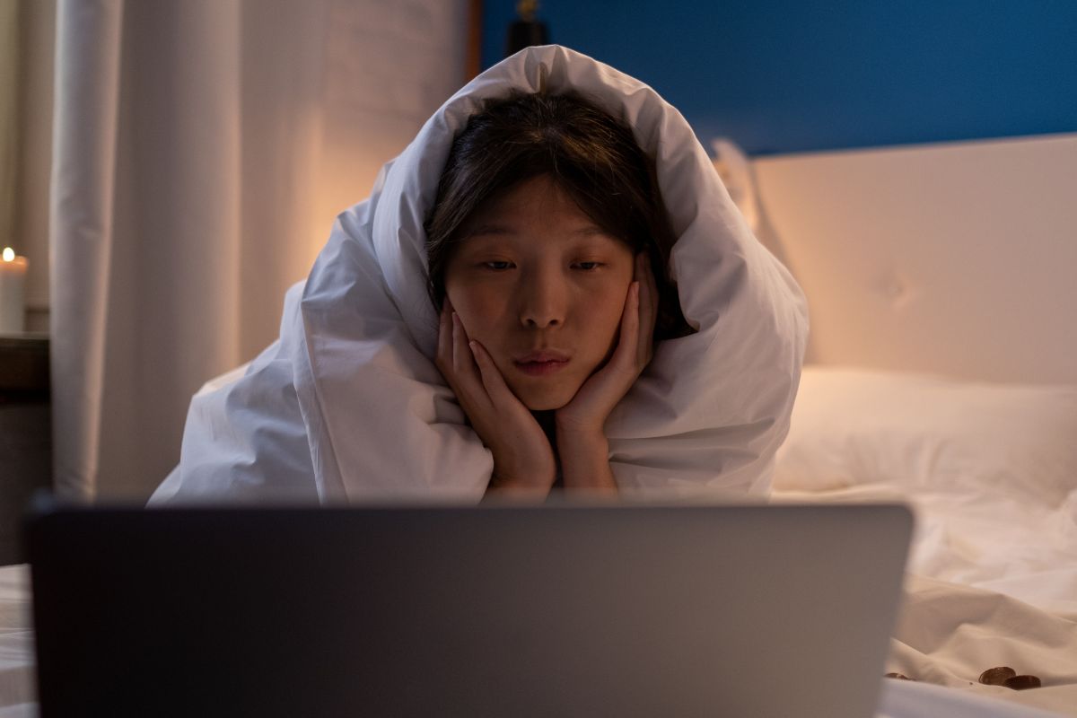 A picture of someone watching something.