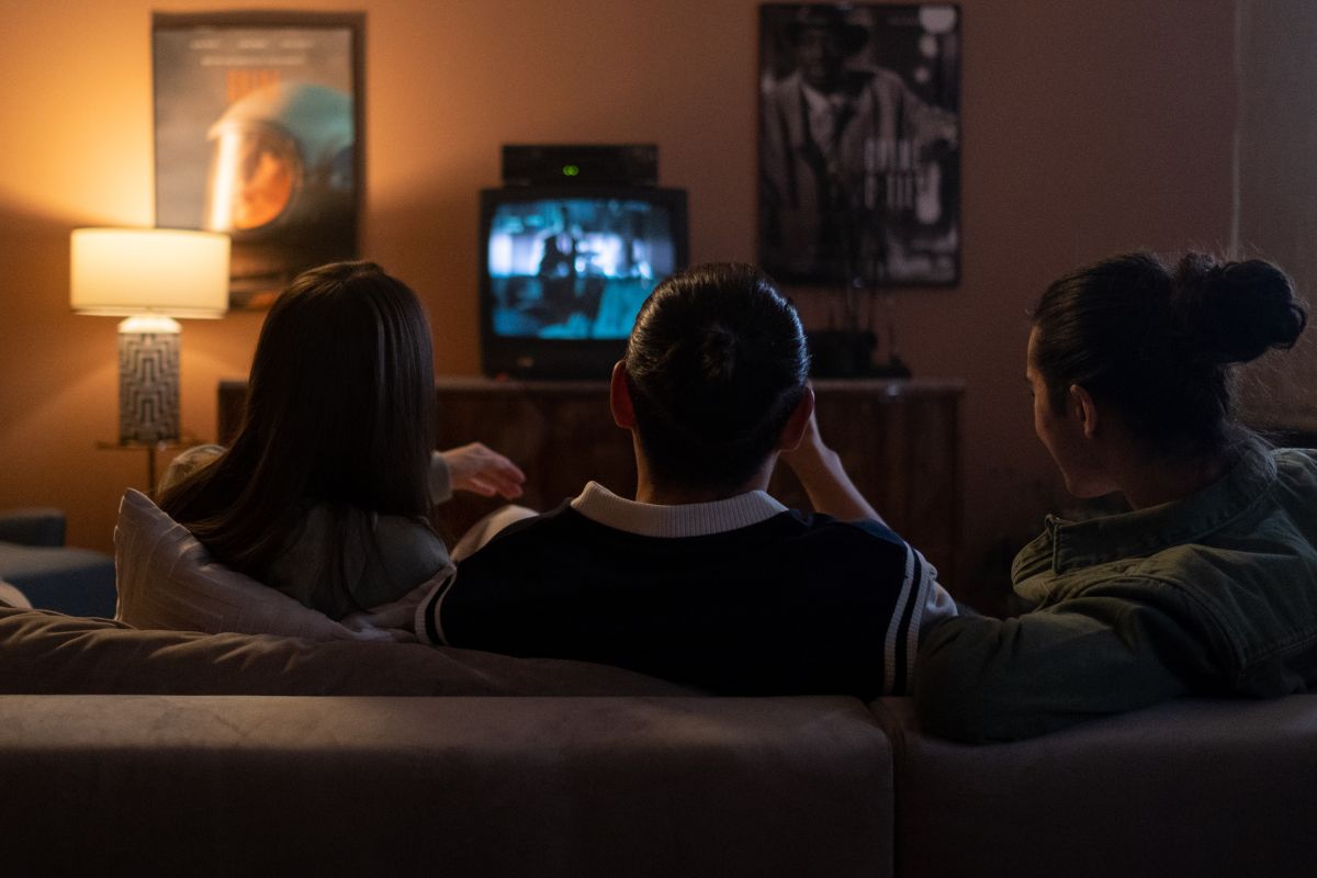 A picture of teens watching a movie.