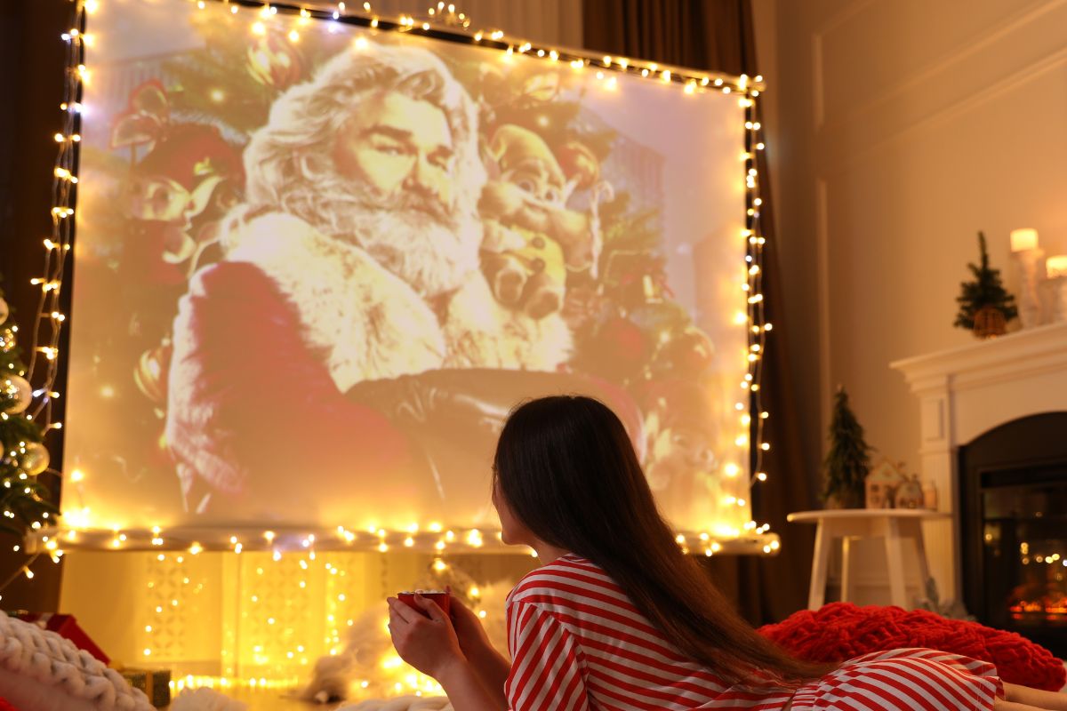 A picture of a teen watching something.