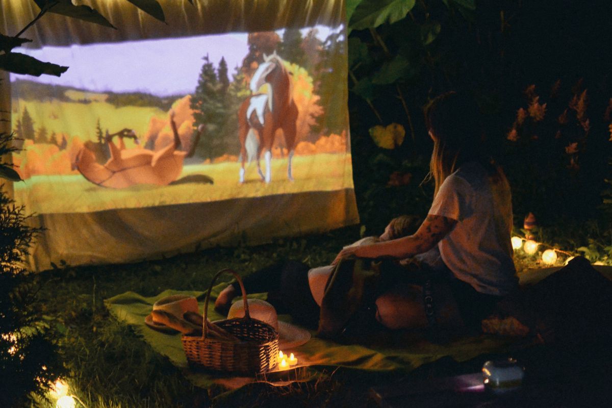 A picture of teens watching a movie.