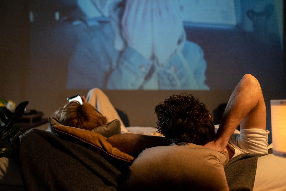 A picture of teens watching a movie.