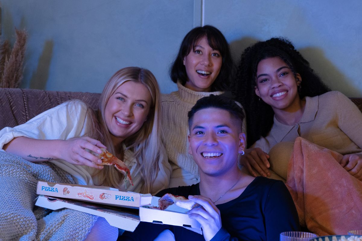 A picture of teens watching something.