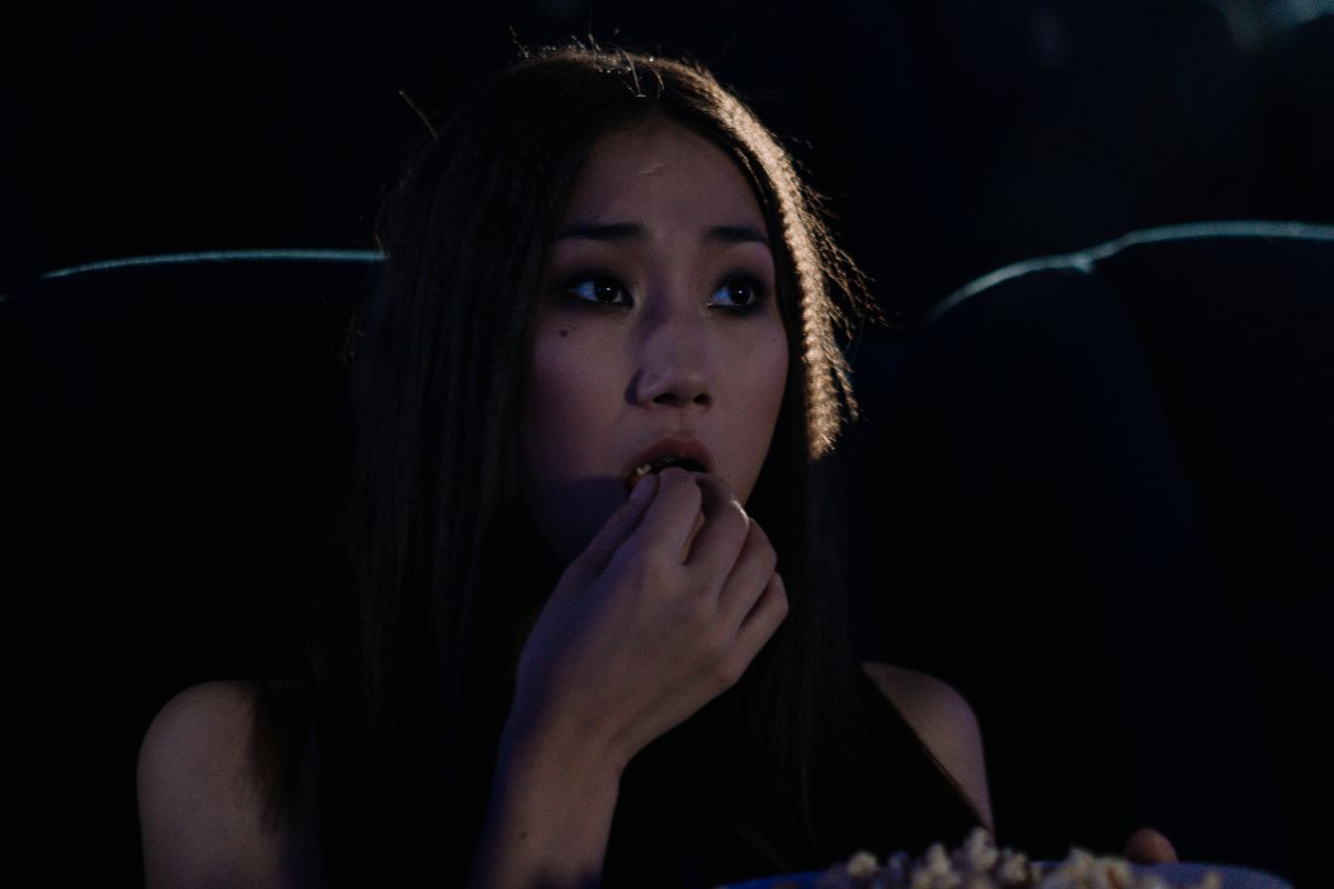 A picture of someone watching something.