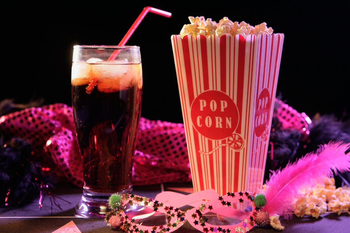 A picture of a drink and a popcorn box.