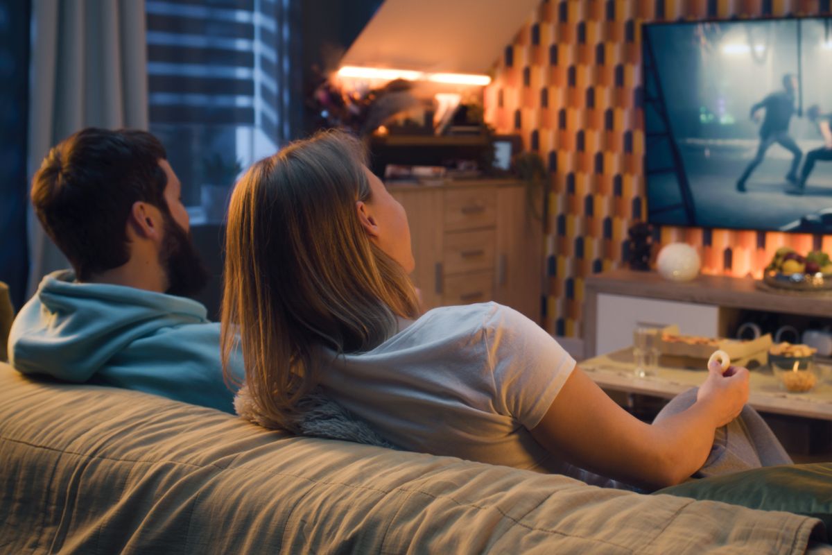 A picture of a couple watching a movie.