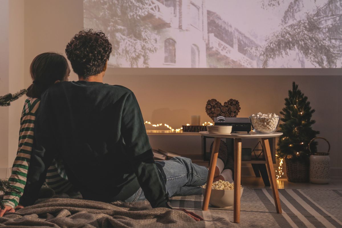 A picture of a couple watching a movie.