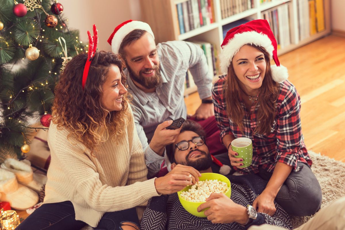 A picture of adults watching something.