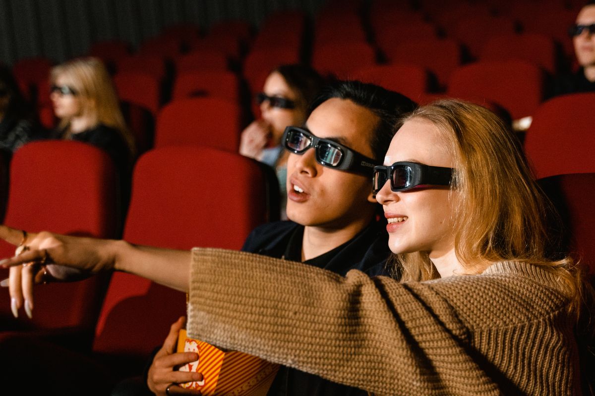 A picture of adults watching in a cinema.