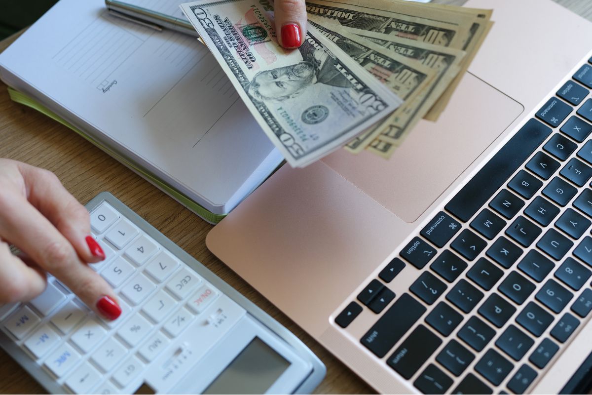 A picture of someone counting money.