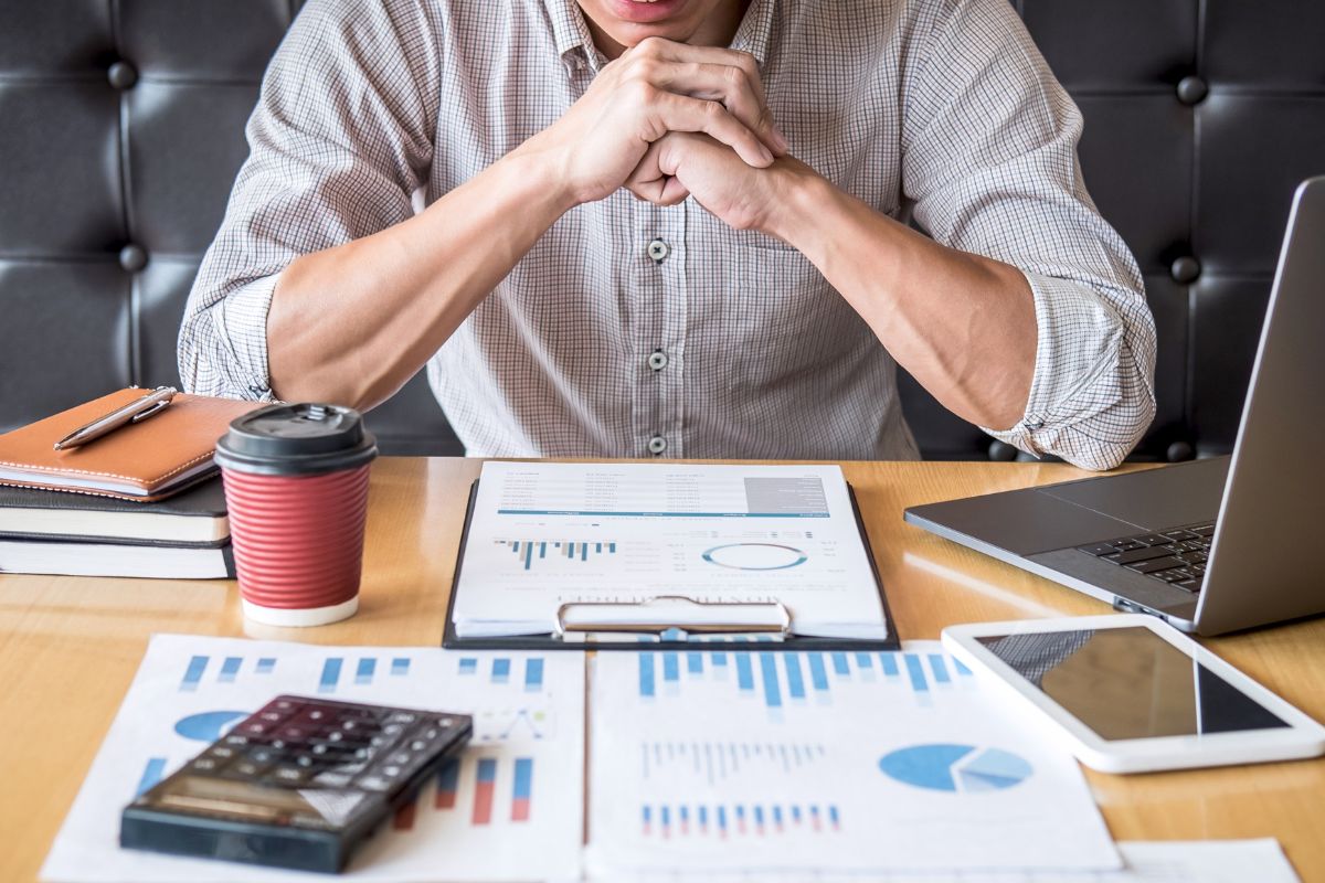 A picture of an investor reviewing their papers.